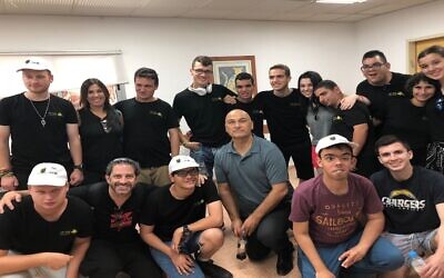 The Toczek family pictured visiting Special in Uniform’s canine training uni. (Credit: JNF-USA)