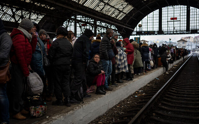 Passengers wait at the platform inside Lviv railway station in western Ukraine, February 27, 2022. (AP Photo/Bernat Armangue, File)