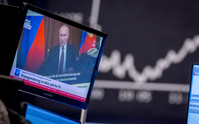Russia's President Vladimir Putin appears on a television screen at the stock market in Frankfurt, Germany, on February 25, 2022. (AP Photo/Michael Probst, File) Russia's President Vladimir Putin appears on a television screen at the stock market in Frankfurt, Germany, on February 25, 2022. (AP Photo/Michael Probst, File)
