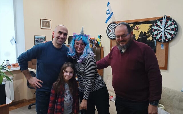 Rabbi Irina Gritsevskaya, in the unicorn wig, traveled to Chernivtski, Ukraine, with Rabbi Avi Novis-Deutsch Dean of the Schechter Rabbinical Seminary (right), March 16, 2022. (Facebook via JTA)