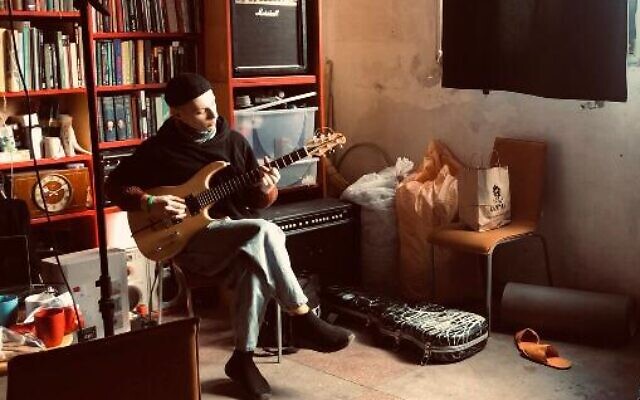 Pavlo Gots (left) plays in his practice space at Zavod, on March 8, 2022. (Lazar Berman/The Times of Israel)