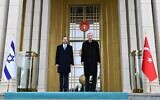 President Isaac Herzog (left) and Turkish President Recep Tayyip Erdoğan outside the presidential complex in Ankara on March 9, 2022. (Haim Zach/GPO)