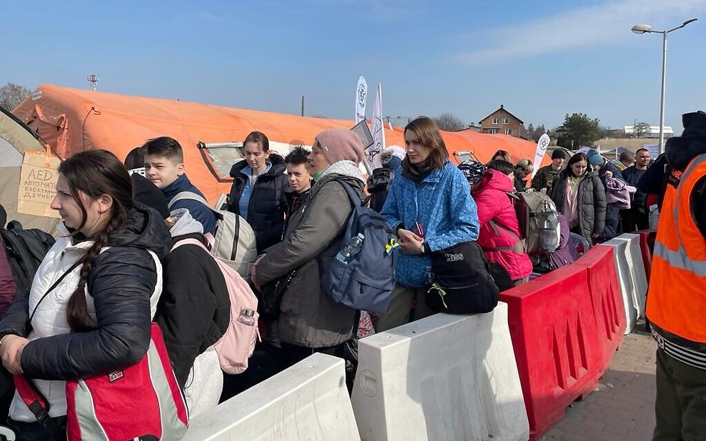 Ukrainian refugees at the border crossing between Poland and Ukraine, at Medyka, Poland, March 15, 2022. (Carrie Keller-Lynn/The Times of Israel)