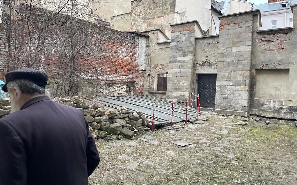 Meylakh Sheykhet, lay leader of the Turei Zehav community, touring its synagogue ruins in Lviv, Ukraine, March 16, 2022. (Carrie Keller-Lynn/The Times of Israel)