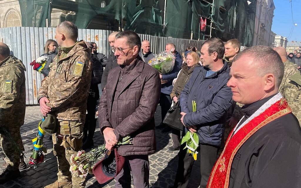 Mourners at the funeral of Colonel Serheii Kohan, killed earlier in the week by a Russian air strike on Yavoriv military base, Lviv, Ukraine, March 18, 2022. (Carrie Keller-Lynn/The Times of Israel)