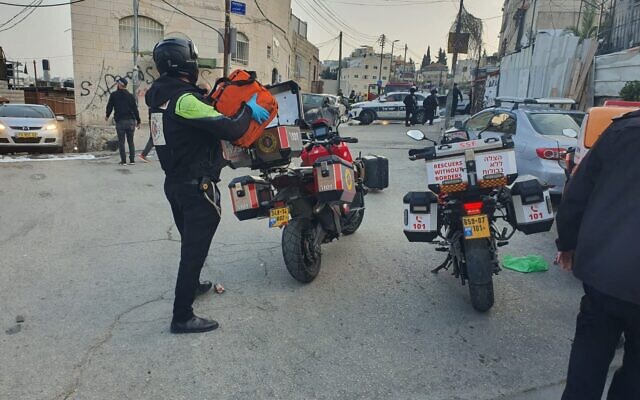 Police officers and medics at the scene of a suspected stabbing attack in East Jerusalem's Ras al-Amud, March 20, 2022. (Rescuers Without Borders) Police officers and medics at the scene of a suspected stabbing attack in East Jerusalem's Ras al-Amud, March 20, 2022. (Rescuers Without Borders)
