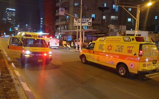 Police and medics at the scene of a deadly terrorist attack in Bnei Brak, on March 29, 2022. (Magen David Adom)