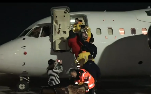 Ukrainian Holocaust survivors and other civilians wounded amid Russia's invasion are taken on a rescue flight to Israel, on March 16, 2022. (Screenshot/Channel 13)