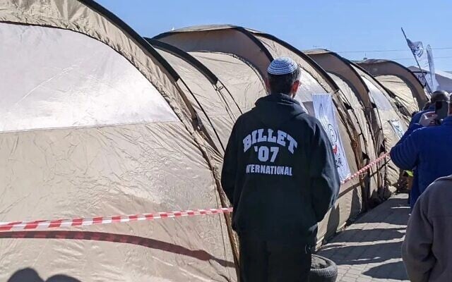 A tent city on the Polish side of the Medyka border crossing with Ukraine provides shelter and supplies for the refugees fleeing the war, March 14, 2022. (Courtesy Menachem Creditor via JTA) A tent city on the Polish side of the Medyka border crossing with Ukraine provides shelter and supplies for the refugees fleeing the war, March 14, 2022. (Courtesy Menachem Creditor via JTA)