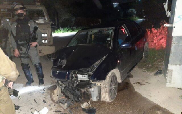 The remains of a car that rammed a Border Police vehicle in the West Bank town of Silat al-Harithiya, March 7, 2022. (Israel Police) The remains of a car that rammed a Border Police vehicle in the West Bank town of Silat al-Harithiya, March 7, 2022. (Israel Police)