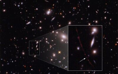 A highly magnified image of the star Earendel. The collection of yellow-looking galaxies form the massive galaxy-cluster lens that magnifies background objects lying behind it. The inset shows the highly magnified red galaxy, host to Earendel, stretched into an arc due to lensing, and the highly magnified star is marked with a white arrow. (NASA, ESA, Brian Welch, Dan Coe)