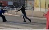 The assailant in a deadly terror spree, right, being shot as he lunges with a knife, after killing four people in Beersheba on March 22, 2022. (screen capture: Channel 13)