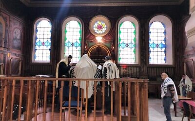 Rosh Chodesh Torah reading at Lviv's Beis Aharon V'Yisrael synagogue, Friday morning, March 4, 2022 (Lazar Berman/Times of Israel)