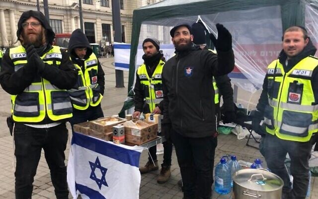 Staff from Zaka's Tel Aviv district in their tent in front of Lviv's train station, March 8, 2022 (Lazar Berman/Times of Israel)