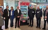 Rabbi Mendy Chitrick stands third from right next to the Istanbul Airport's new kosher vending machine. (Rabbi Mendy Chitrik)