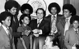 Mayor Sam Massell, center, and his daughter Melanie, seated, welcome members of the Jackson Five to the mayor’s office in Atlanta, April 7, 1971. (Afro American News via Getty Images via JTA)