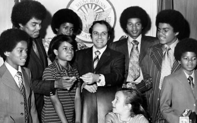 Mayor Sam Massell, center, and his daughter Melanie, seated, welcome members of the Jackson Five to the mayor’s office in Atlanta, April 7, 1971. (Afro American News via Getty Images via JTA)