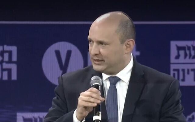 Prime Minister Naftali Bennett speaking at a conference organized by the Ynet news site in Jerusalem, March 21, 2022. (screenshot)