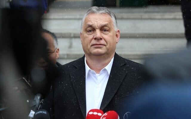Hungarian Prime Minister Viktor Orban speaks to media after casting his ballot, during the National Parliament elections at a polling station in Budapest on April 3, 2022. (FERENC ISZA / AFP)