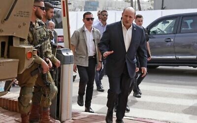 Prime Minister Naftali Bennett arrives at the Beit El army headquarters in the West Bank, on April 5, 2022. (Menahem Kahana/AFP) Prime Minister Naftali Bennett arrives at the Beit El army headquarters in the West Bank, on April 5, 2022. (Menahem Kahana/AFP)