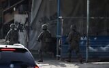 IDF soldiers are seen operating in the Nur Shams Palestinian refugee camp on April 10,2022, during a raid looking for terror suspects (JAAFAR ASHTIYEH / AFP)