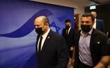Prime Minister Naftali Bennett walks to a cabinet meeting at his office in Jerusalem April 10, 2022. (RONEN ZVULUN / POOL / AFP)