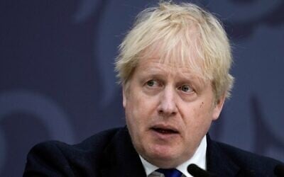 Britain's Prime Minister Boris Johnson makes a speech on immigration, at Lydd Airport, in southeast England, on April 14, 2022. (Matt Dunham/Pool/AFP)
