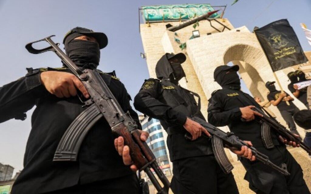 Members of Palestinian Islamic Jihad terror group take part in a demonstration marking Palestinian Prisoners' Day in Rafah town in the Southern Gaza Strip, on April 17, 2022. (Said Khatib/AFP)