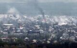 A photograph taken from Novodruzhesk village, shows smoke rising in Rubizhne city, on April 18, 2022, on the 54th day of the Russian invasion of Ukraine. (Ronaldo Schemidt/AFP)