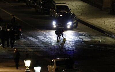 Police officers investigate the site where two people were shot by police in Paris on April 25, 2022. (Ludovic MARIN / AFP)