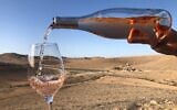 Pouring a Nana Estate Winery rose while looking out toward the unlikely desert terroir of this Negev vineyard. (Courtesy: Nana Winery)
