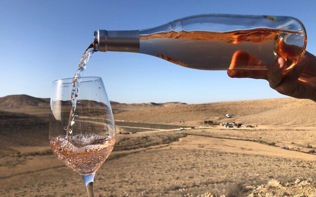 Pouring a Nana Estate Winery rose while looking out toward the unlikely desert terroir of this Negev vineyard. (Courtesy: Nana Winery)