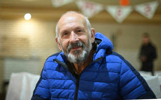 A bus driver known as Dede Mayer waits for dinner at the Jewish refugee camp in Irshava, Ukraine, April 4, 2022. (Cnaan Liphshiz/ JTA)