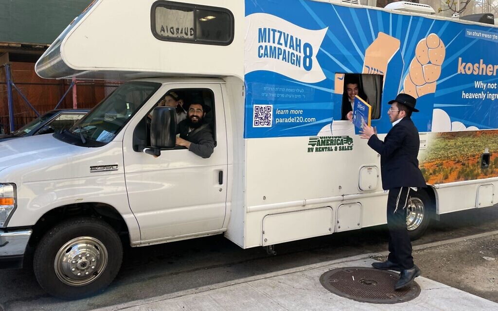 A rabbi and his students from Oholei Torah in Crown Heights, Brooklyn prepare to hand out shmura matzah to passersby near Lincoln Center in Manhattan, April 12, 2022. (Jackie Hajdenberg via JTA) A rabbi and his students from Oholei Torah in Crown Heights, Brooklyn prepare to hand out shmura matzah to passersby near Lincoln Center in Manhattan, April 12, 2022. (Jackie Hajdenberg via JTA)