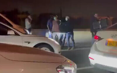Yamam officers detain a Palestinian suspect on the Route 6 highway near the Nahshonim Junction, April 3, 2022. (Screenshot: Twitter)