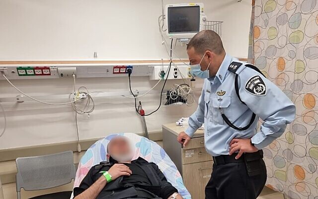 A police officer hospitalized after being wounded in a stabbing attack in Ashkelon, April 12, 2022 (Israel police) A police officer hospitalized after being wounded in a stabbing attack in Ashkelon, April 12, 2022 (Israel police)