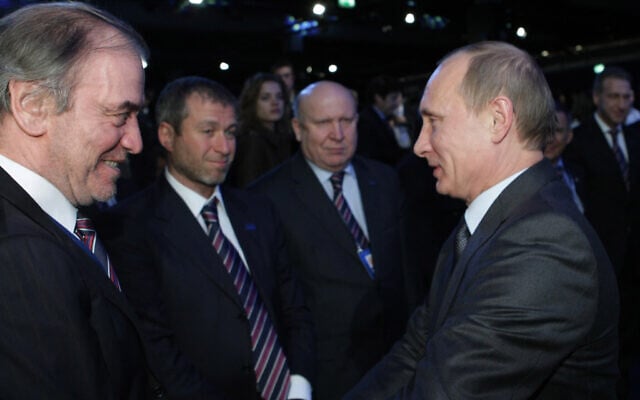 File: Russian Prime Minister Vladimir Putin, right, congratulates members of the Russian delegation after Russia was announced being the host for the 2018 soccer World Cup in Zurich, Switzerland, December 2, 2010. From left: famous conductor Valery Gergiyev, businessman Roman Abramovich, and Nizhny Novgorod governor Valery Shantsev. (AP Photo/Alexei Nikolsky, pool) File: Russian Prime Minister Vladimir Putin, right, congratulates members of the Russian delegation after Russia was announced being the host for the 2018 soccer World Cup in Zurich, Switzerland, December 2, 2010. From left: famous conductor Valery Gergiyev, businessman Roman Abramovich, and Nizhny Novgorod governor Valery Shantsev. (AP Photo/Alexei Nikolsky, pool)