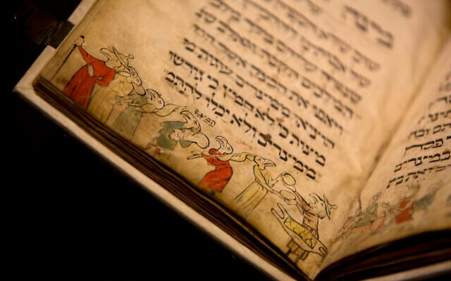 In this photo taken April 20, 2016, the famed Birds' Head Haggadah, a medieval copy of a text read around the Passover holiday table, is seen on display at the Israel Museum in Jerusalem. (AP Photo/Sebastian Scheiner) In this photo taken April 20, 2016, the famed Birds' Head Haggadah, a medieval copy of a text read around the Passover holiday table, is seen on display at the Israel Museum in Jerusalem. (AP Photo/Sebastian Scheiner)