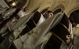 Egyptian Coptic Christian priests pray during the Easter Eve service at St. Mark's Cathedral in Cairo, Egypt, April 15, 2017. (AP Photo/Nariman El-Mofty)