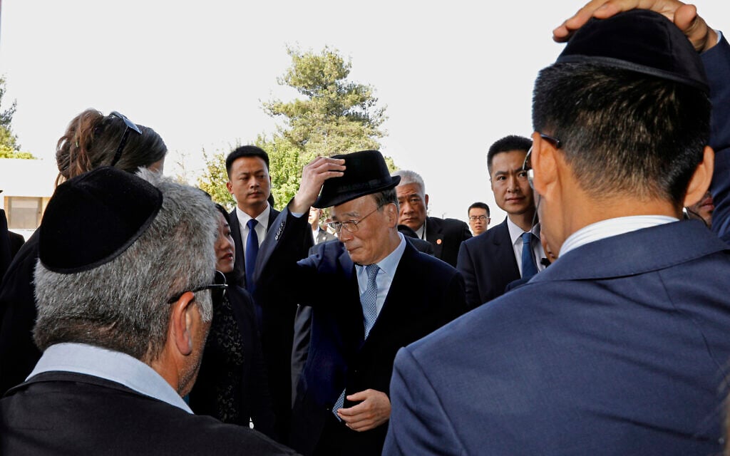 Chinese Vice President Wang Qishan, center, gestures as he attends a memorial ceremony at the Hall of Remembrance as he visits the Yad Vashem Holocaust Memorial museum in Jerusalem, Wednesday, October 24, 2018. (Gali Tibbon/Pool Photo via AP)