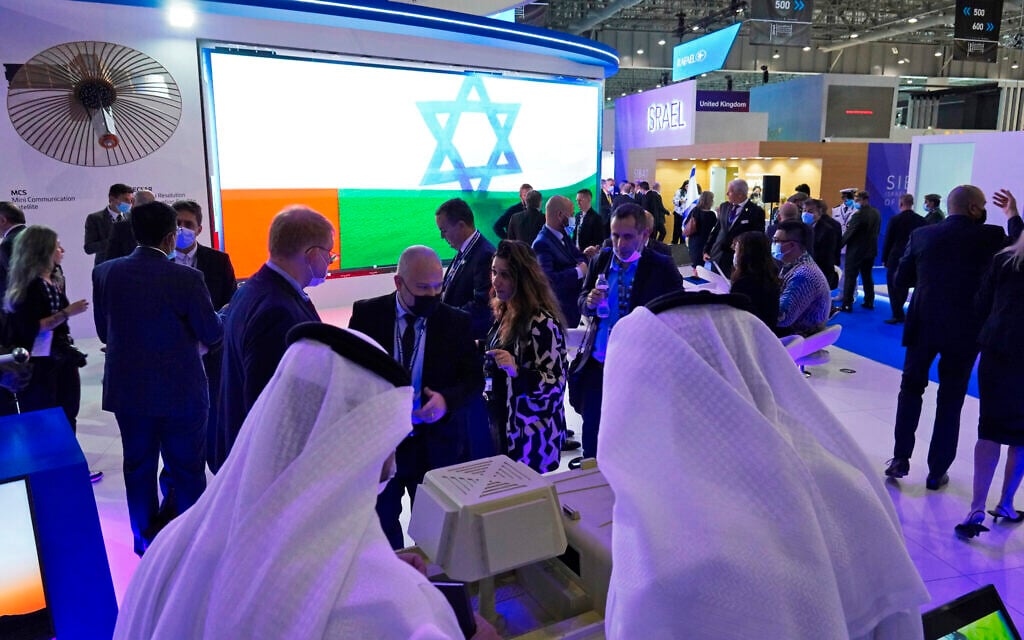 Illustrative: People visit the Israeli stand at the Dubai Air Show in Dubai, United Arab Emirates, November 15, 2021. (AP Photo/Jon Gambrell) Illustrative: People visit the Israeli stand at the Dubai Air Show in Dubai, United Arab Emirates, November 15, 2021. (AP Photo/Jon Gambrell)