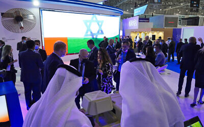 Illustrative: People visit the Israeli stand at the Dubai Air Show in Dubai, United Arab Emirates, November 15, 2021. (AP Photo/Jon Gambrell)