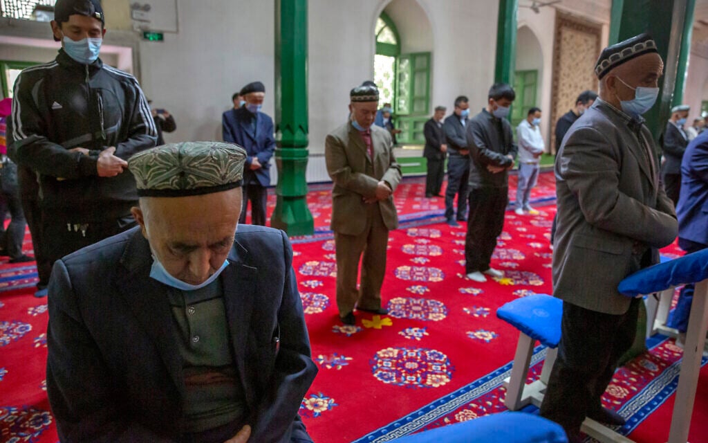 Uyghurs and other members pray during services at the Id Kah Mosque in Kashgar in far west China's Xinjiang region, as seen during a government organized visit for foreign journalists on April 19, 2021. (AP/Mark Schiefelbein)