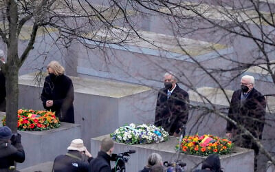 Knesset Speaker Mickey Levy, center, and German President Frank-Walter Steinmeier, right, and Parliament President Baerbel Bas attend a wreath laying ceremony at the Memorial to the Murdered Jews of Europe on the International Holocaust Remembrance Day in Berlin, Germany, January 27, 2022. (AP Photo/Markus Schreiber)