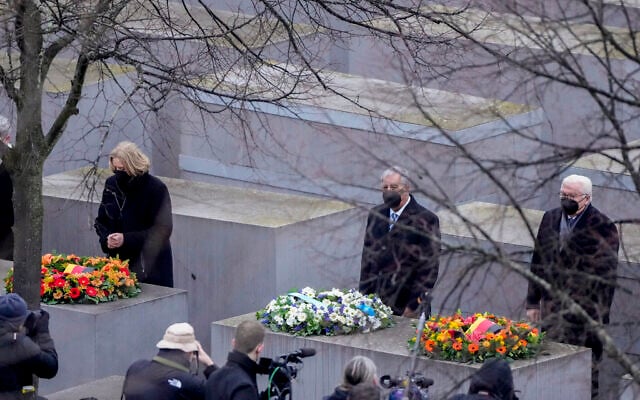 Knesset Speaker Mickey Levy, center, and German President Frank-Walter Steinmeier, right, and Parliament President Baerbel Bas attend a wreath laying ceremony at the Memorial to the Murdered Jews of Europe on the International Holocaust Remembrance Day in Berlin, Germany, January 27, 2022. (AP Photo/Markus Schreiber) Knesset Speaker Mickey Levy, center, and German President Frank-Walter Steinmeier, right, and Parliament President Baerbel Bas attend a wreath laying ceremony at the Memorial to the Murdered Jews of Europe on the International Holocaust Remembrance Day in Berlin, Germany, January 27, 2022. (AP Photo/Markus Schreiber)