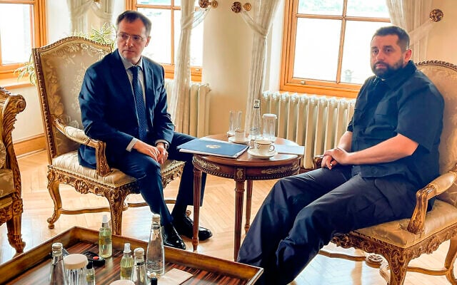 In this photo released by Ukrainian Foreign Ministry Press Service, Russian Presidential aide Vladimir Medinsky, left, and the head of the Ukrainian Servant of the People faction Davyd Arakhamia pose for media during talks between Russian and Ukrainian delegations in Dolmabahce Palace, Istanbul, on March 29, 2022. (Ukrainian Foreign Ministry Press Service via AP)