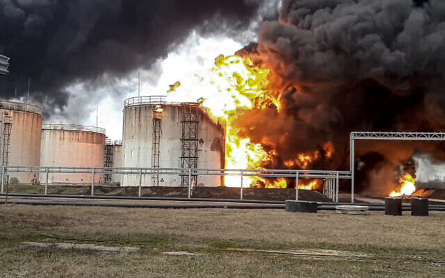 In this handout photo released by Russian Emergency Ministry Press Service on Friday, April 1, 2022, a view of the site of fire at an oil depot in Belgorod region, Russia. (Russian Emergency Ministry Press Service via AP)