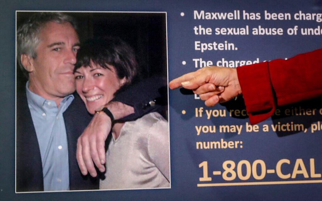 Audrey Strauss, acting US attorney for the Southern District of New York, points to a photo of Jeffrey Epstein and Ghislaine Maxwell, during a news conference in New York, on July 2, 2020. (AP Photo/John Minchillo, File)