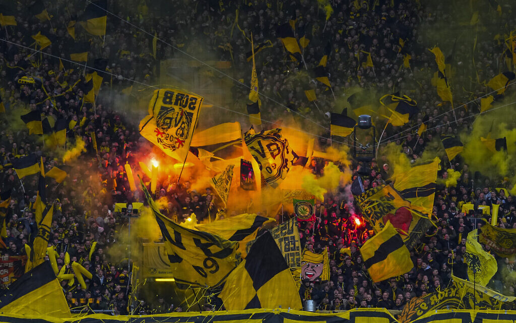 Illustrative: Dortmund fans set off flares at the start of the German Bundesliga soccer match between Borussia Dortmund and RB Leipzig in Dortmund, Germany, April 2, 2022. (AP Photo/Martin Meissner)
