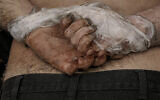 A lifeless body of a man with his hands tied behind his back lies on the ground in Bucha, Ukraine, Sunday, April 3, 2022. (AP Photo/Vadim Ghirda)